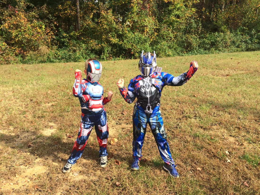 two boys in a field in costumes